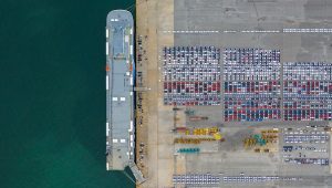 Aerial view cars export terminal, New cars waiting for import export at deep sea port.